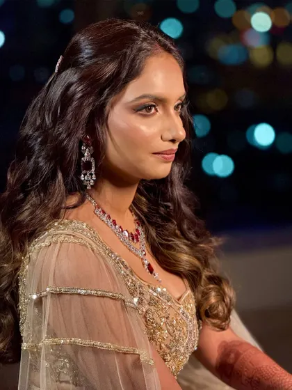 A side profile against a bokeh background, creating a very cinematic and romantic feel.