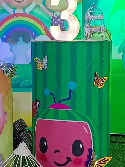 A close-up of the Cocomelon theme props. We use high-quality printed plinths and character cutouts to bring the theme to life in vivid detail.