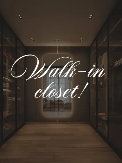 A view down the aisle of the bespoke walk-in closet. The symmetrical design, warm wood flooring, and integrated lighting create a luxurious and highly organized dressing room experience.