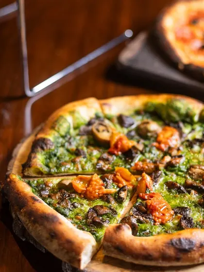 A slice is missing from this Fungi pizza, suggesting it was too good to wait for a photo. It's a fun way to show how tempting my food is.