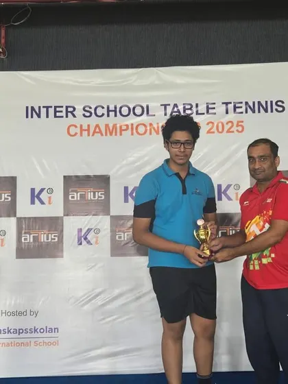 One of our Under-17 players receiving his trophy after securing 3rd place at the Inter-School Table Tennis Championship. Competing in such events is a core part of our training program.