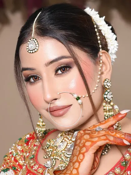 A close-up showing the detailed henna and the flawless makeup application by one of my students.