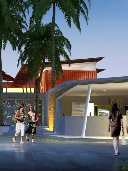 This view highlights the pedestrian-friendly approach to the restaurant, with open-fronted kiosks and informal seating areas that invite social interaction and create a lively atmosphere.