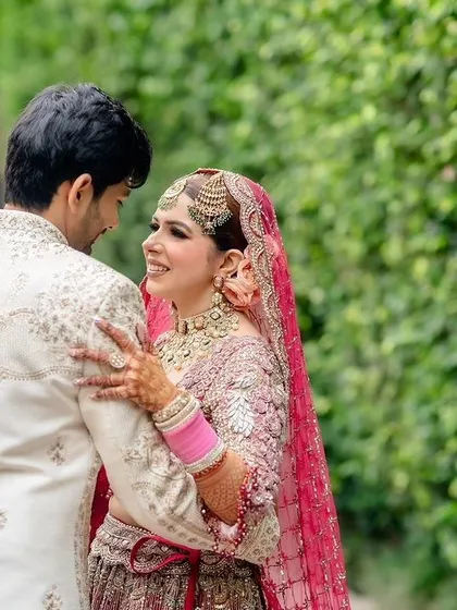 A candid moment of affection between the bride and groom.