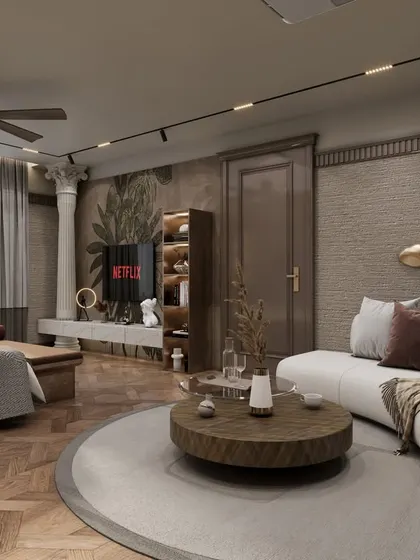 The seating area of the master bedroom, with a curved white sofa and a classical column detail. A large, botanical wallpaper behind the TV adds character and a touch of nature.