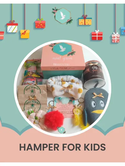 A fun and colorful hamper for kids. This box is filled with a soft toy, seed bombs for a green activity, a cute headband, and other surprises to spark their imagination.