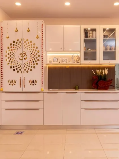 A wider view of the multifunctional unit, showing how the pooja and crockery cabinets are integrated into a single, cohesive piece of furniture, saving space in the dining area.