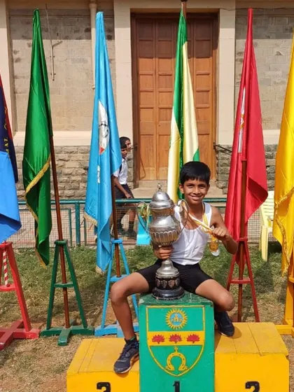 Pure joy and accomplishment. Here is Irvin, one of our junior champions, on the podium after winning the athletic championship in his category.