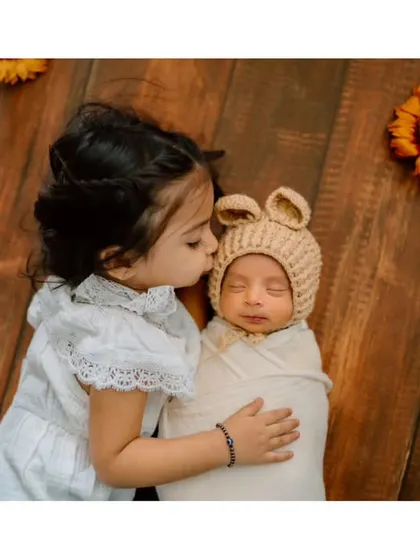 A sister's first kiss for her new baby brother. Capturing the beginning of a lifelong bond is one of the most special parts of my job.