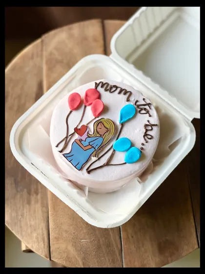 A sweet cake for a mom-to-be, featuring a lovely illustration of an expecting mother holding her belly, surrounded by pink and blue balloons. It's perfect for a baby shower or gender reveal.