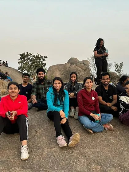 A group resting on the rocks at Uttari Betta. The varied terrain offers plenty of spots to pause, chat, and enjoy the scenery.