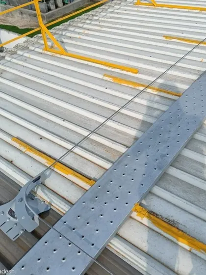 A detailed view of the safety lifeline and walkway system on a metal roof. This is a critical component of our installations, ensuring that future maintenance and inspections can be carried out safely and efficiently.