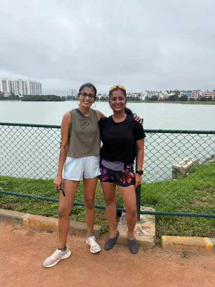A post run picture with a friend by the lake. My coaching often involves running with clients, sharing tips and enjoying the journey together.