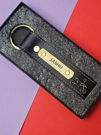 This faux leather keychain is personalized with a nameplate and a motorcycle charm. It comes in a gift box, making it an ideal small present or add-on.
