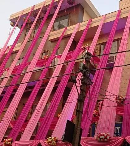 A modern house decorated with bright pink drapes for a wedding event. I can create contemporary looks using fabric and flowers to match the style of your home.