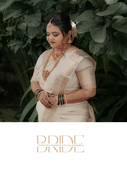 A simple and elegant graphic overlay celebrating the bride. The photo captures her in a moment of serene beauty, dressed in a classic white and gold saree.