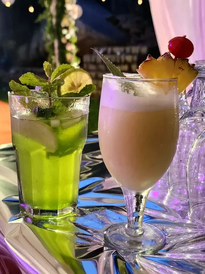 A refreshing Green Apple Mojito and a creamy Piña Colada from my mocktail bar. I create a wide range of colorful and delicious non-alcoholic drinks to complement the food.