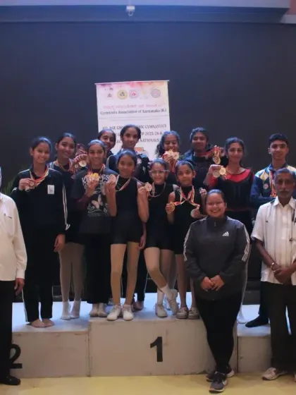 The result of dedication. Our aerobic gymnastics team celebrating their well-deserved wins at the State Championship. We don't just build gymnasts; we build champions.