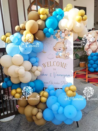 A sweet welcome sign for a twins' baby welcome party, featuring a teddy bear theme and a soft blue and brown color palette.