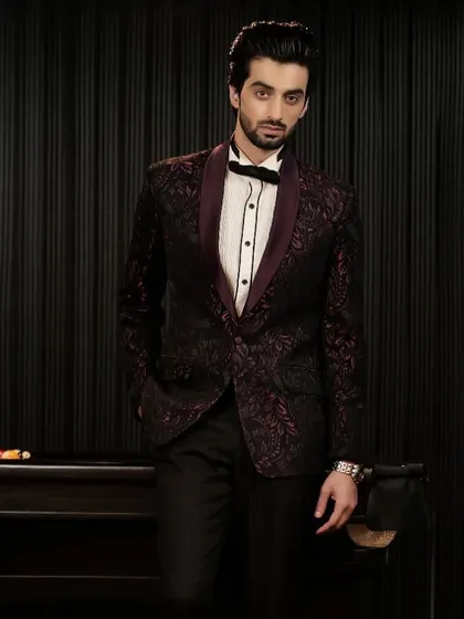 A full view of the patterned burgundy tuxedo. The subtle texture of the jacquard fabric adds depth and interest to this sophisticated evening look.