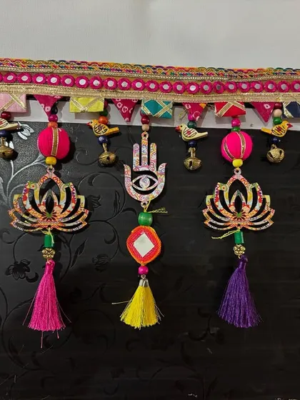 Another angle of the sold 'Shubh Toran'. You can see the little bird charms and bells nestled between the larger elements. It’s these small details that bring a piece to life.