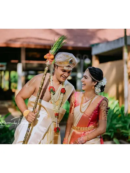 A happy, laughing moment between the bride and groom.