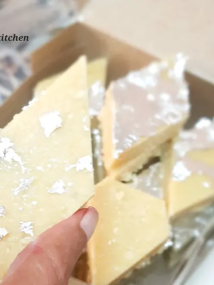 A close up of my homemade Kaju Katli, decorated with edible silver leaf. I make this classic sweet with a smooth texture and the perfect level of sweetness, ensuring it tastes just like it should.
