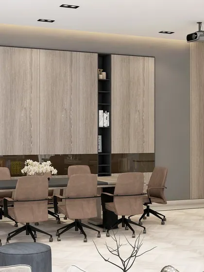 This conference room features extensive built-in storage and a large meeting table, set against a backdrop of marble and wood panels for a sophisticated look.