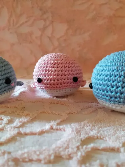 My little whale buddies all in a row. These chubby, round plushies are simple, cute, and made with soft cotton yarn, perfect for a nursery or as a small gift.