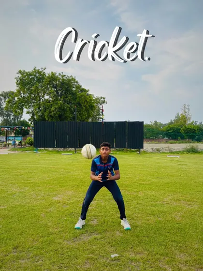 Eyes on the ball. A young fielder positions himself perfectly to take a catch, showing great concentration.