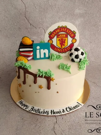 This cake combines a couple's favorite things: Manchester United, LinkedIn, and mangoes. I created custom fondant elements, including a tiny, realistic mango, to make it personal.