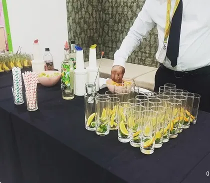Preparing fresh ingredients like lemon and mint for a classic Virgin Mojito.