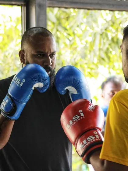 Two fighters facing off. The respect between opponents is a core part of the boxing code.