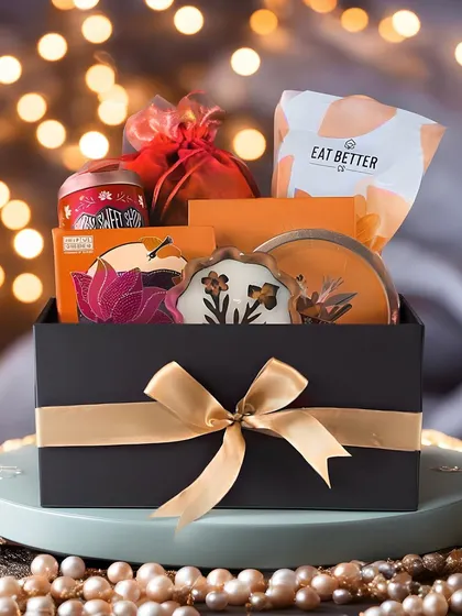 We bring the sparkle to your festive celebrations. This premium Diwali hamper, set against a backdrop of festive lights, features a curated selection of gourmet treats and elegant decor items, perfect for showing appreciation to clients and employees.