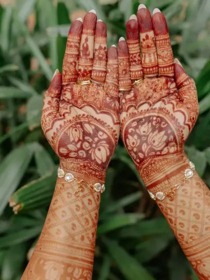 A stunning close-up of the bride's intricate Mehendi design, a work of art for her special day.