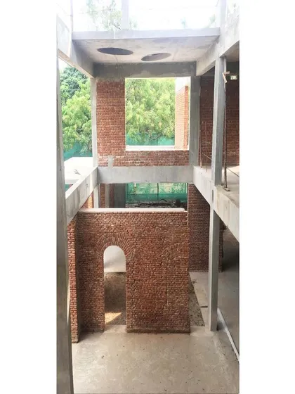 In this adaptive reuse project, we left the original brick arches and walls exposed, weaving them into the new structure to create a dramatic overlap of old and new.