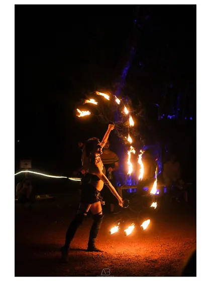 Capturing the mesmerizing art of fire dancing. The long exposure trails of the flames create a dynamic and magical effect in the dark.