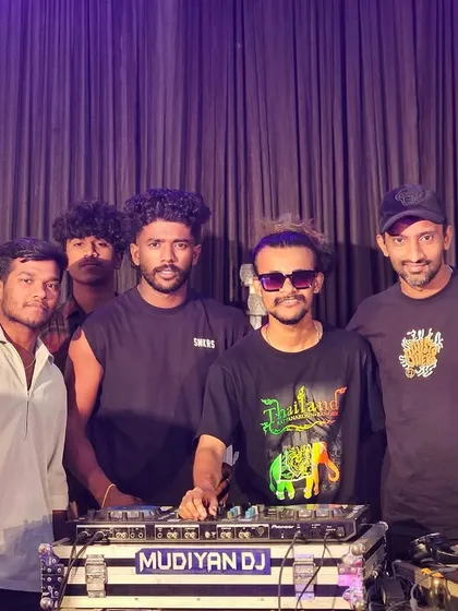 A group photo with my crew behind the decks after a successful wedding performance.