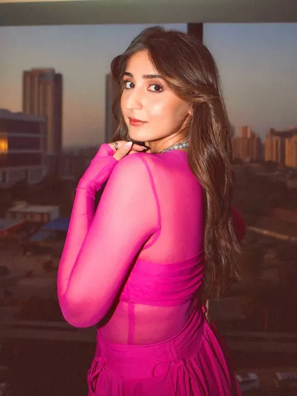 A burst of color! This vibrant, sheer pink custom outfit is all about fun and high energy, perfect for making a bold statement.