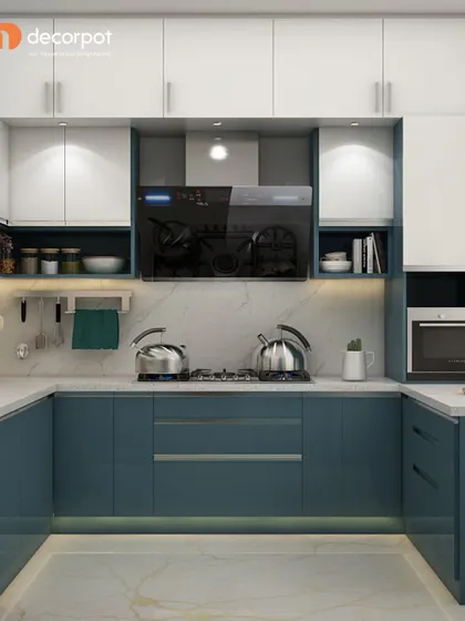 A U-shaped kitchen in a striking teal and white combination. The high-gloss finish reflects light, making the space feel bright and spacious, while the layout offers an abundance of counter and storage space.