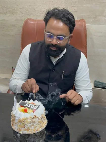 Capturing the moment of a birthday celebration. A positive work environment is key to success.