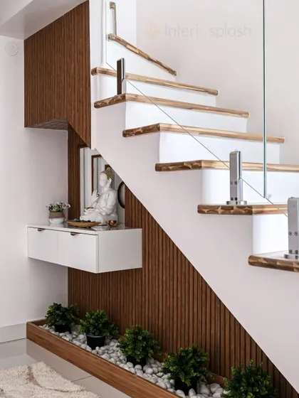 Another angle of the under-stair foyer, showing the combination of wood panelling and white walls. It's a great example of maximizing unused space.