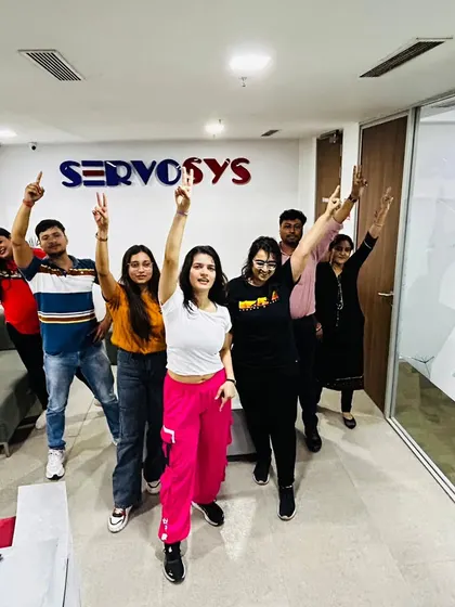 Victory poses and big smiles after a successful corporate Zumba session at Servosys. These moments of shared fun and accomplishment are what build a stronger, more connected team.