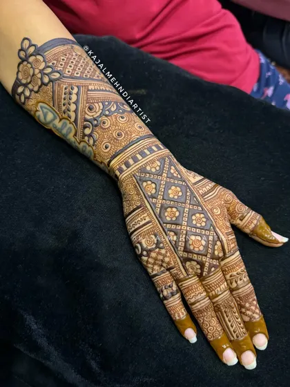 A heavy bridal backhand design filled with rich, geometric patterns. The intricate grid work and floral borders create a stunning and bold look.
