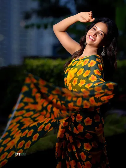 Another angle showing the beautiful movement of the saree. These dynamic shots are perfect for capturing the vibrant energy of an outdoor photoshoot.