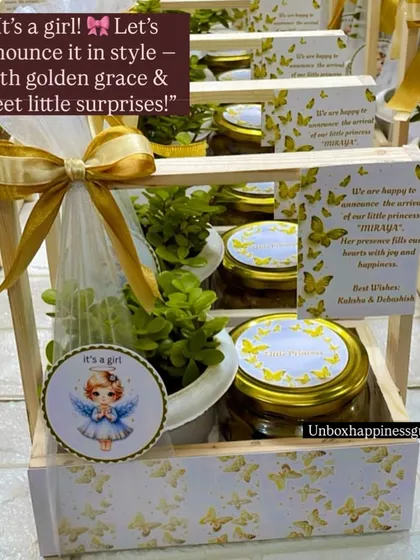 A detailed view of the custom-printed wooden basket with a butterfly motif, part of an elegant baby girl announcement favor set.