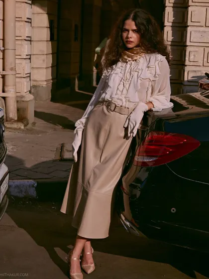 A full-length portrait from our vintage-inspired shoot. The warm sunlight and classic architecture of Mumbai create a beautiful, nostalgic atmosphere.
