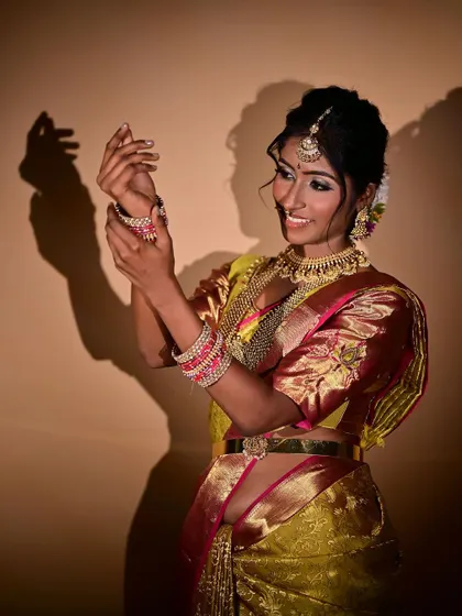 This candid-style shot captures a natural smile. My makeup application ensures that the look is beautiful not just in static poses but also in moments of genuine expression.