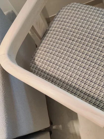 The custom dining chair, now with its seat upholstered in a beautiful patterned fabric. The final piece is a perfect blend of form and function.