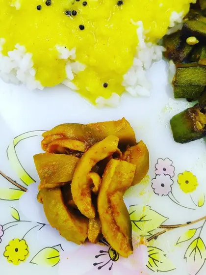 My oil-free Hing ka Achaar served with a simple meal of dal, rice, and bhindi. This pickle uses raw mango seasoned with asafoetida and is very good for digestion.